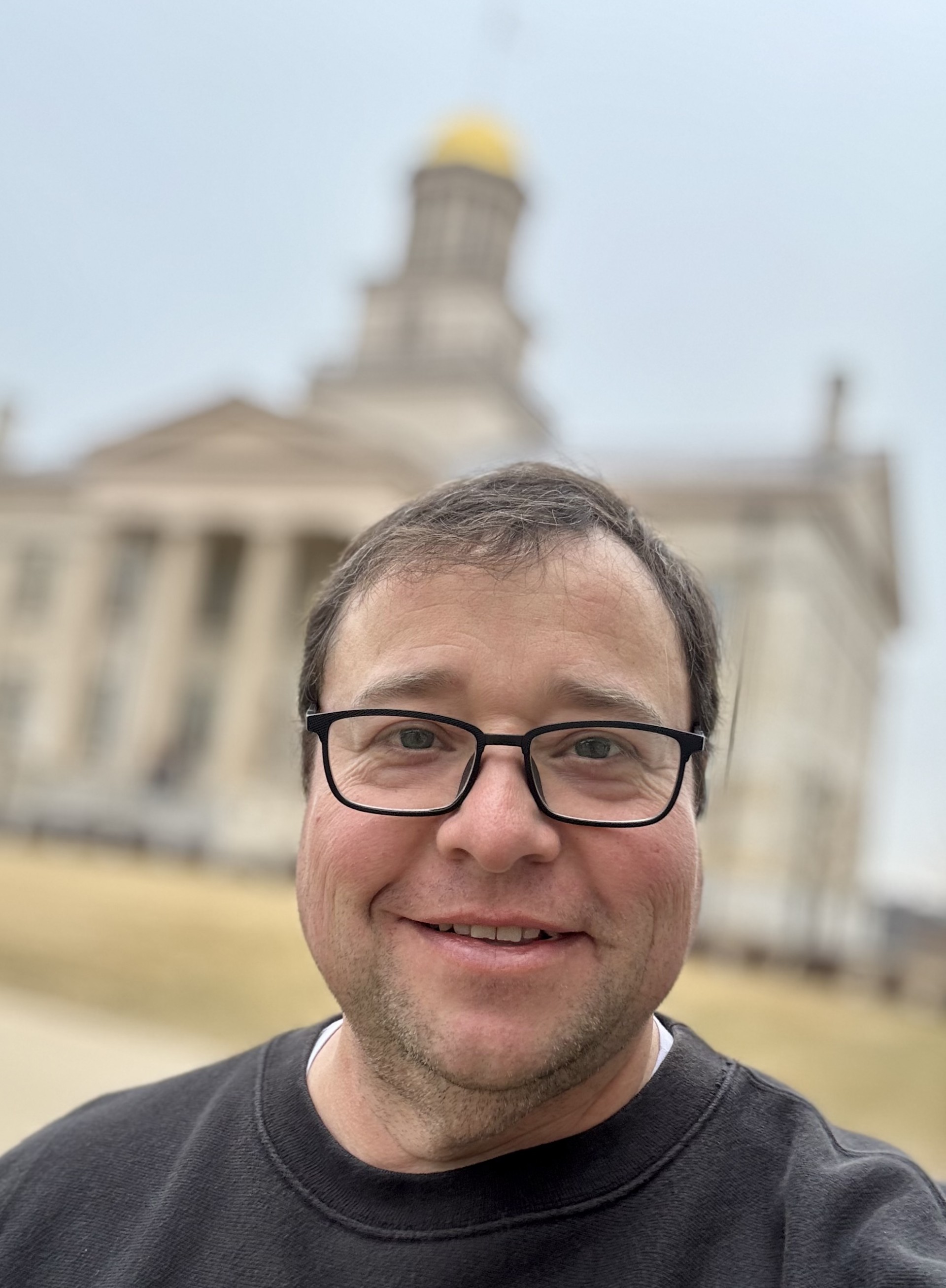Troy Ferring, owner of Photal Recall, in front of the Old Capitol building in Iowa City